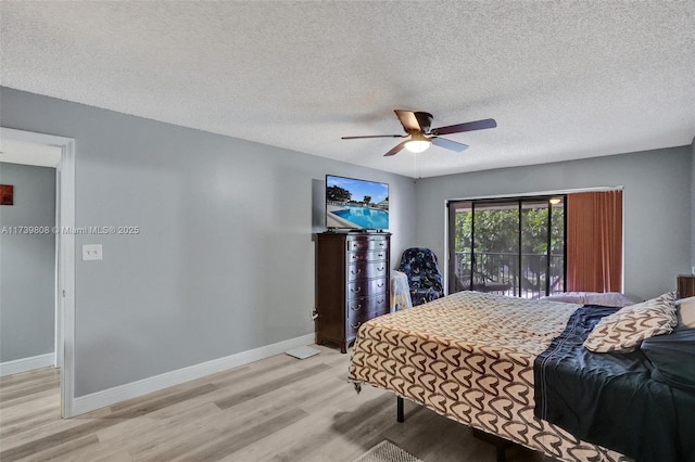 bedroom with baseboards, a ceiling fan, and light wood-style flooring