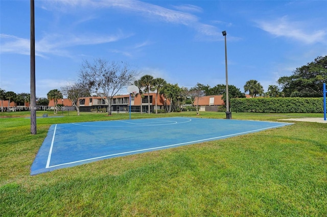 view of sport court featuring a lawn and community basketball court
