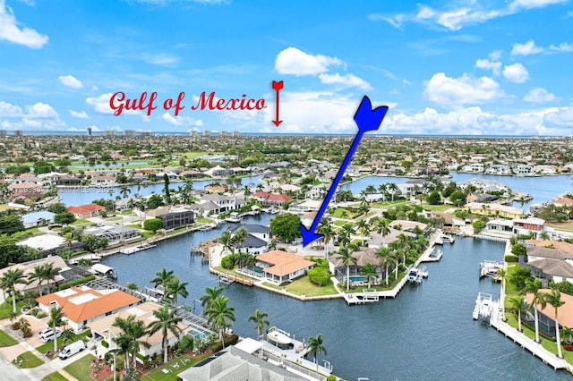 bird's eye view featuring a water view and a residential view