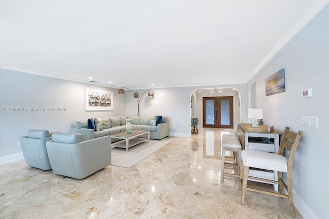 living room with baseboards, arched walkways, ornamental molding, marble finish floor, and french doors