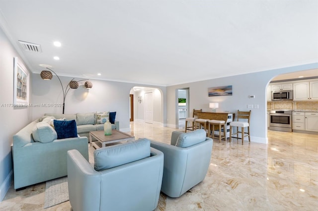 living area featuring arched walkways, visible vents, baseboards, marble finish floor, and crown molding