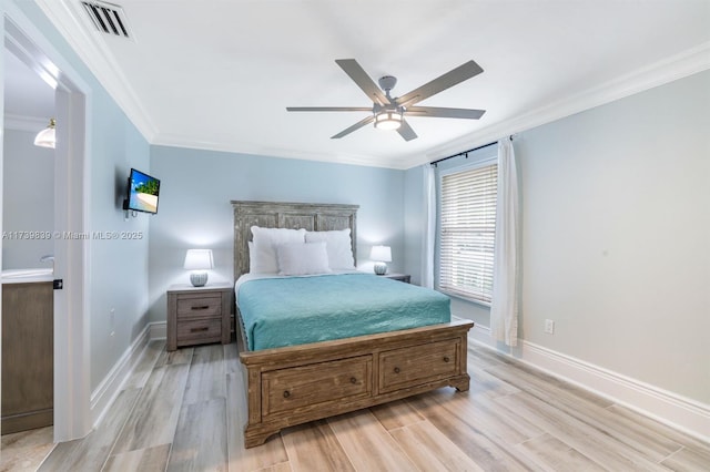 bedroom featuring ornamental molding, baseboards, and light wood finished floors