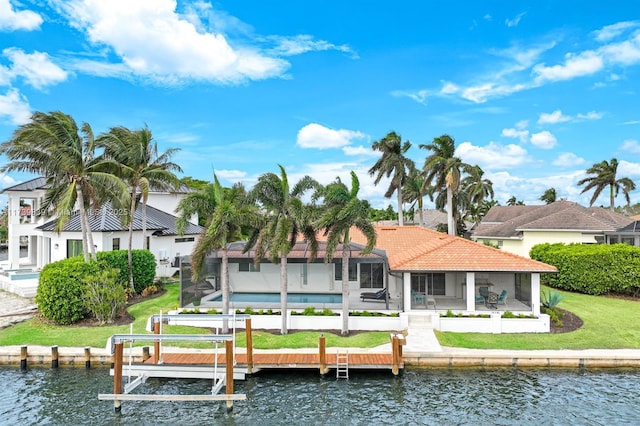 rear view of house featuring boat lift, a lanai, a water view, a tile roof, and a pool