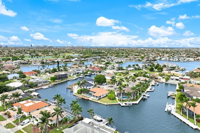 birds eye view of property with a residential view and a water view