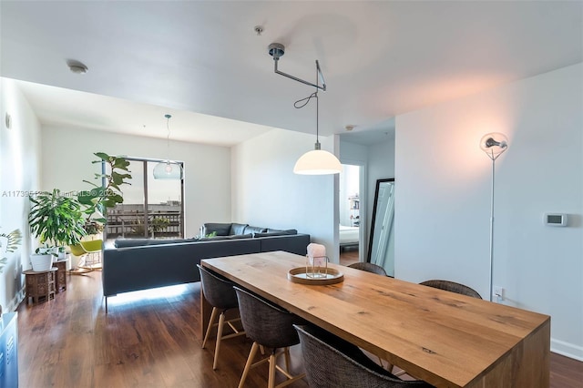 dining space featuring dark hardwood / wood-style floors