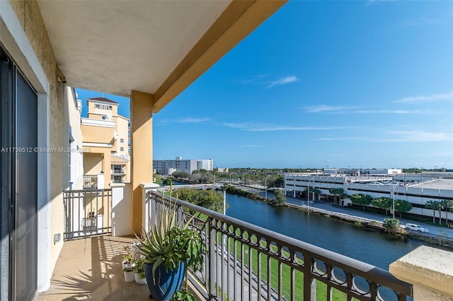 balcony featuring a water view