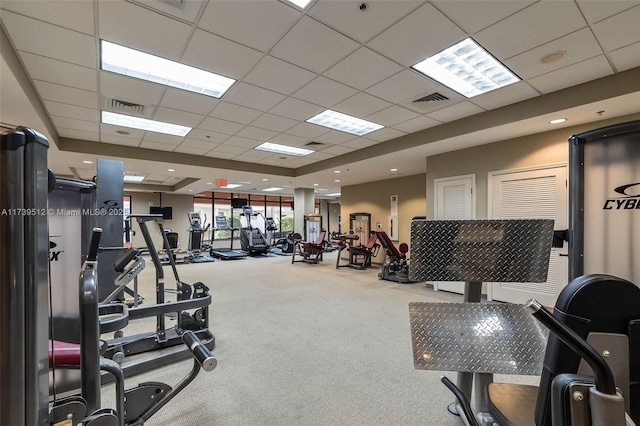 workout area with carpet and a drop ceiling