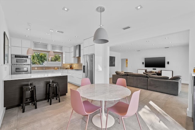 dining area featuring sink