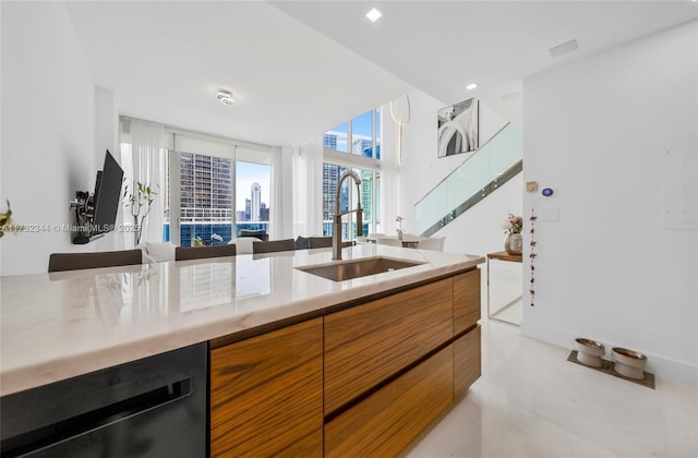 kitchen featuring black dishwasher, sink, and wine cooler