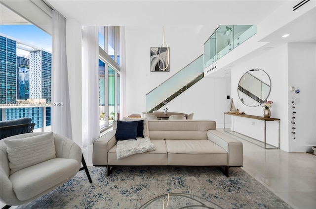 living room featuring floor to ceiling windows