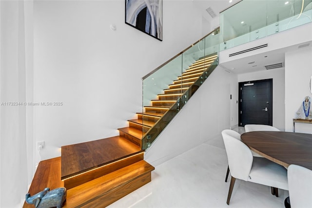 stairway with a high ceiling