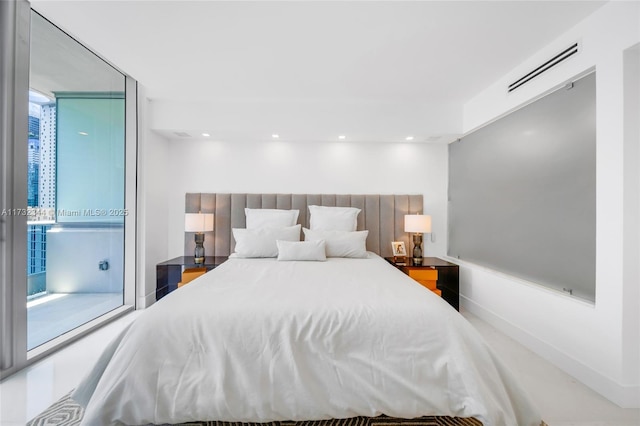 bedroom featuring floor to ceiling windows