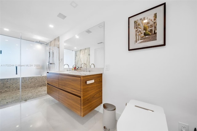 bathroom with vanity and walk in shower