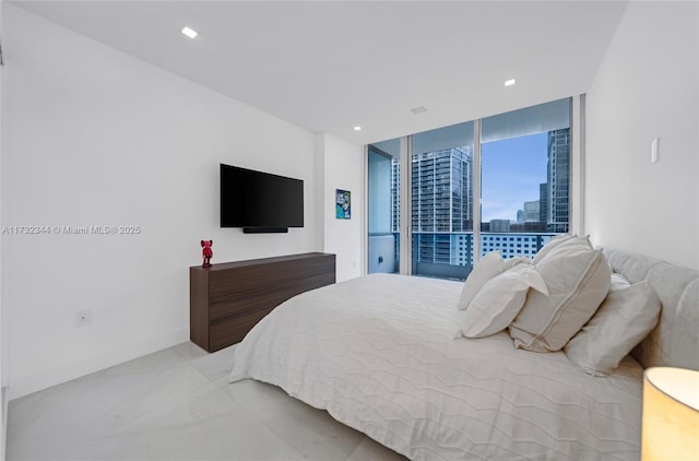 bedroom featuring floor to ceiling windows