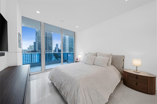 bedroom featuring floor to ceiling windows and access to outside