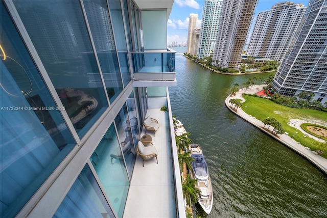 balcony featuring a water view