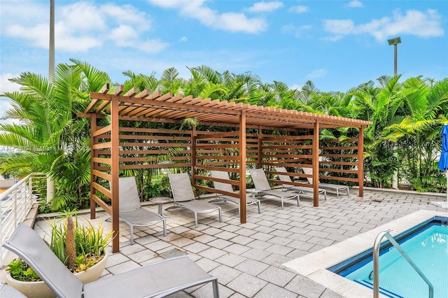 view of patio / terrace featuring a pool and a pergola