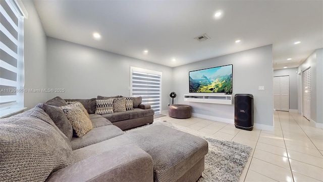 living room with light tile patterned floors