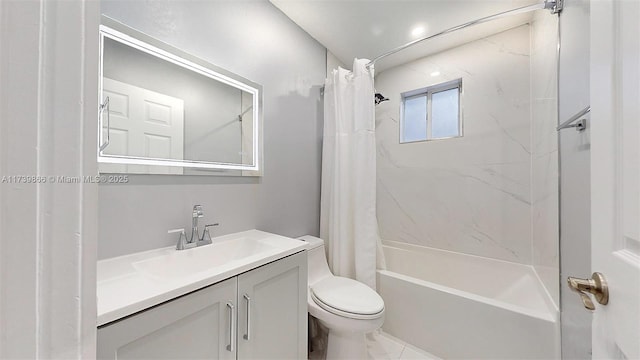 full bathroom with vanity, shower / tub combo with curtain, and toilet