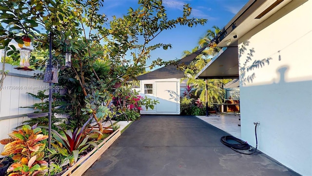 view of patio / terrace with a storage shed