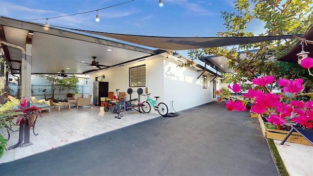 view of patio featuring ceiling fan