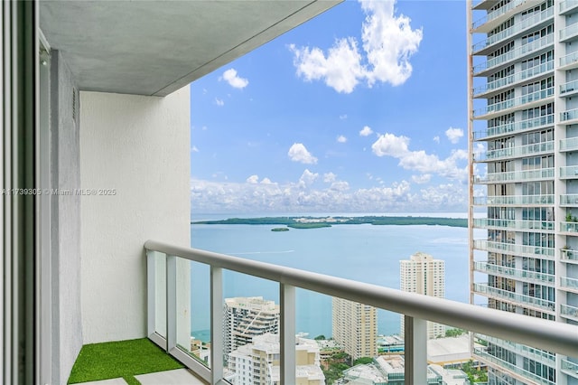 balcony featuring a water view