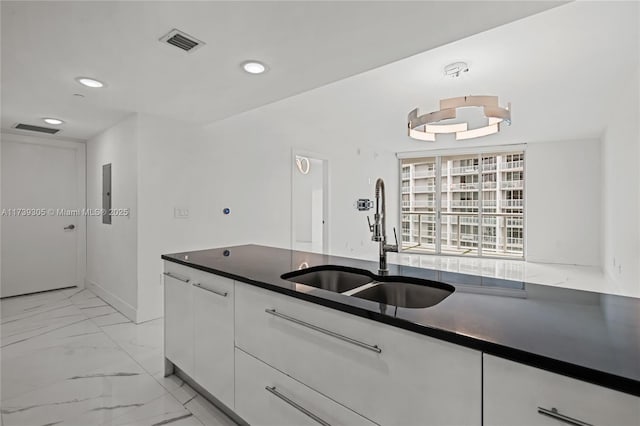 kitchen with sink and white cabinets