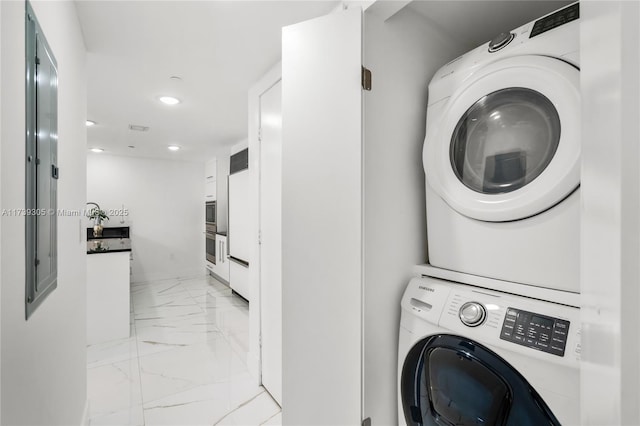 laundry room featuring stacked washer and clothes dryer