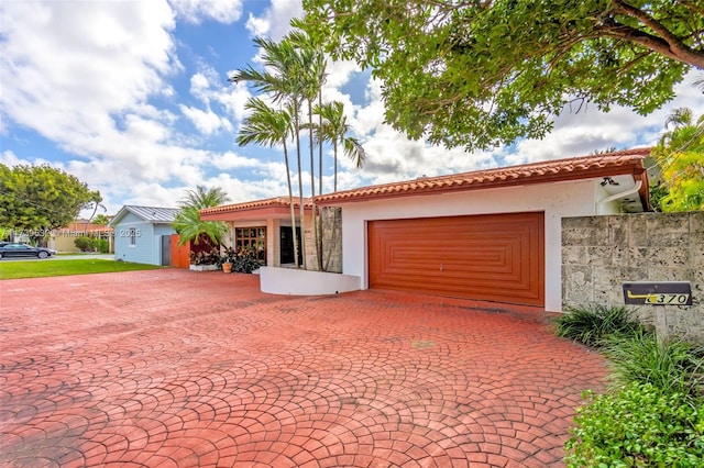 view of front of property with a garage