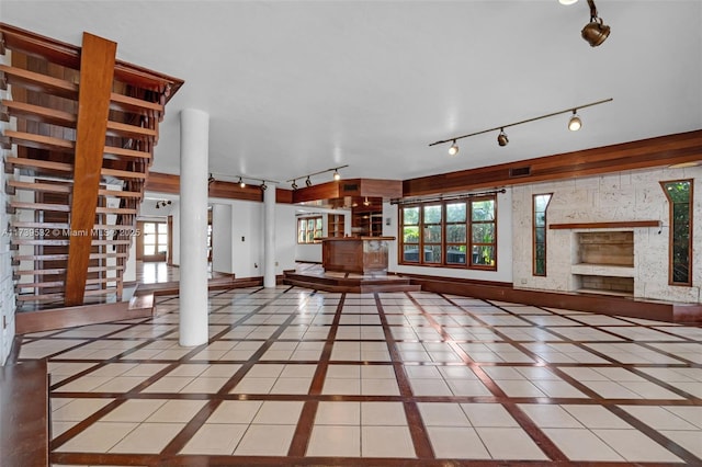 unfurnished living room with tile patterned floors