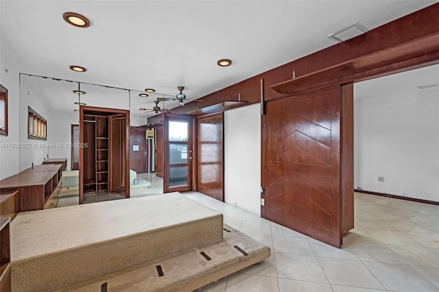 kitchen with light tile patterned floors and ceiling fan