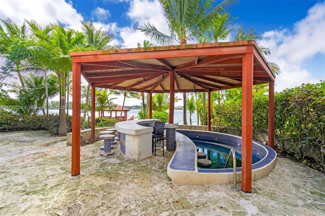 view of patio / terrace featuring a water view