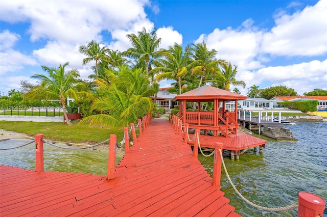 dock area with a gazebo and a water view