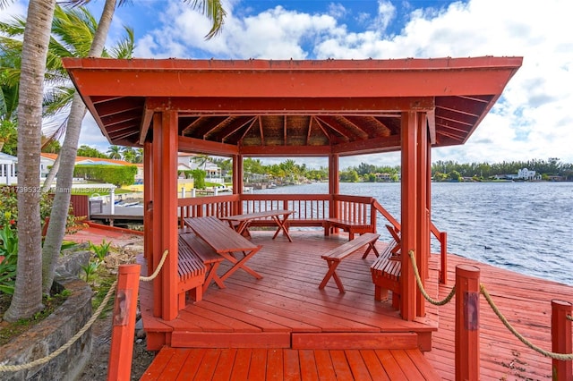 view of dock featuring a water view and a gazebo