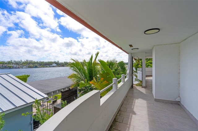 balcony featuring a water view