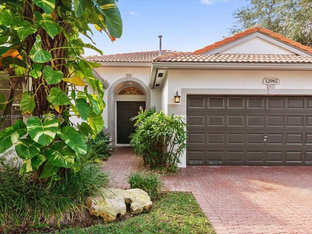 mediterranean / spanish-style house featuring a garage