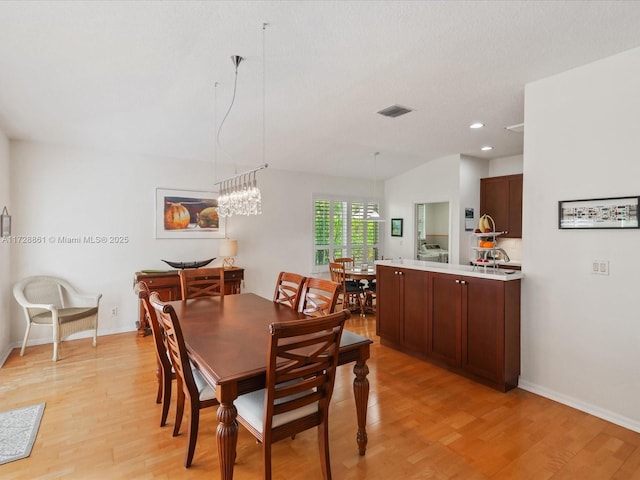 dining room with light hardwood / wood-style floors