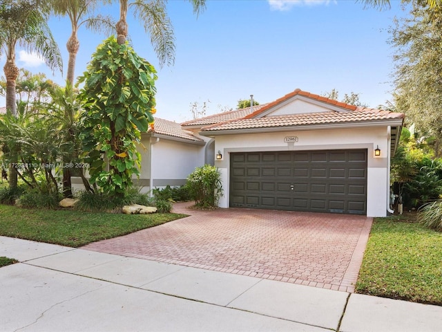 mediterranean / spanish-style house featuring a garage