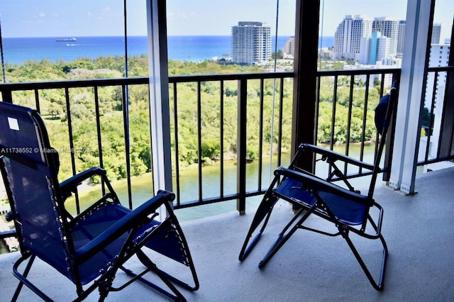 balcony with a city view and a water view