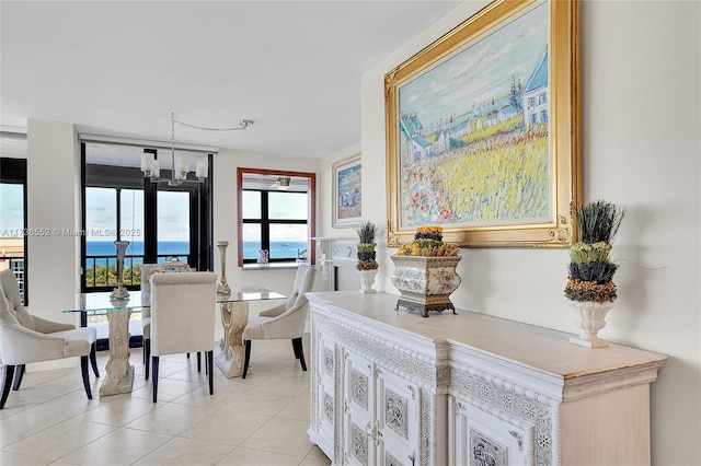 dining room with an inviting chandelier and light tile patterned flooring