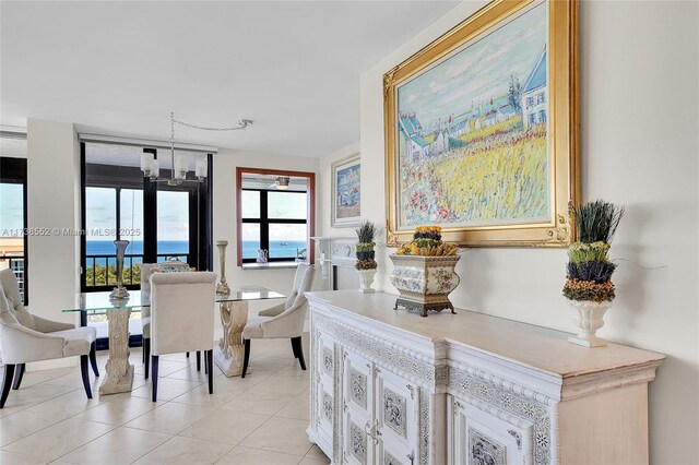 936 Intracoastal Dr Unit 21A, Fort Lauderdale, FL 33304 - dining area featuring light tile patterned floors and a notable chandelier