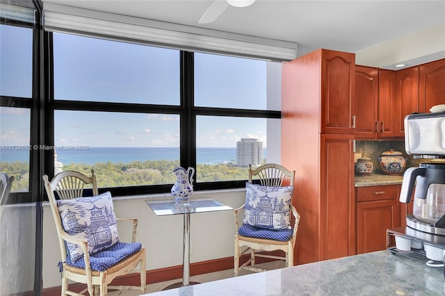 kitchen with backsplash and a water view