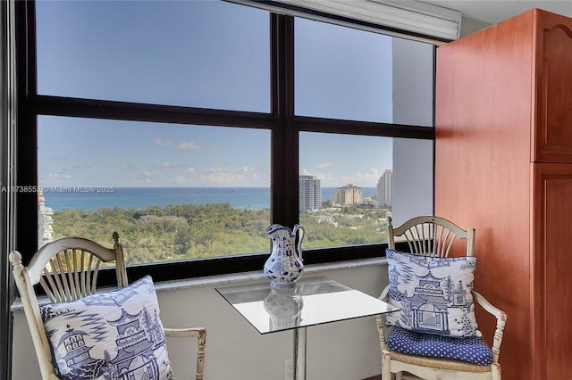 bedroom featuring a city view and a water view