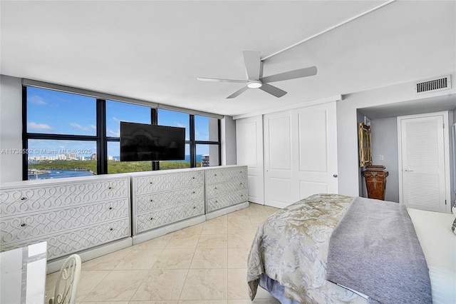 936 Intracoastal Dr Unit 21A, Fort Lauderdale, FL 33304 - bedroom featuring a closet, visible vents, ceiling fan, and a wall of windows