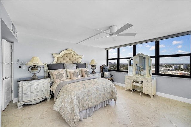 bedroom with baseboards and a ceiling fan