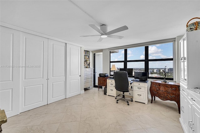 office area with ceiling fan