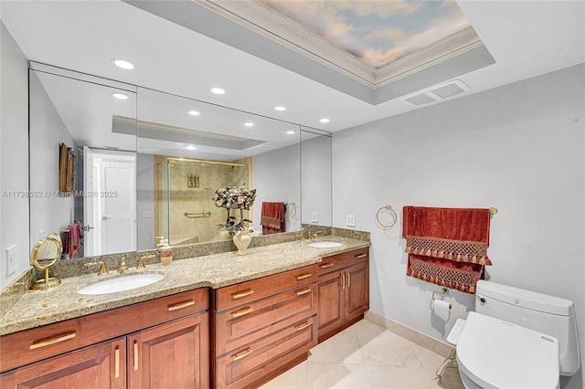 full bath with a tray ceiling, a stall shower, visible vents, and a sink