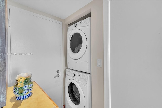 936 Intracoastal Dr Unit 21A, Fort Lauderdale, FL 33304 - clothes washing area featuring stacked washer and clothes dryer and laundry area