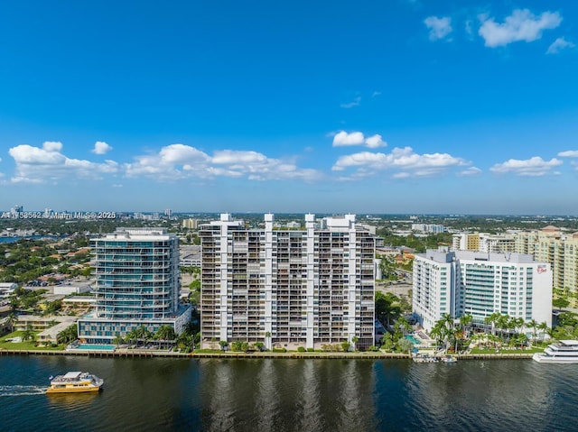 birds eye view of property with a view of city and a water view