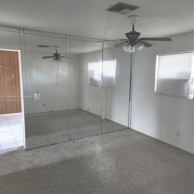 unfurnished bedroom with a closet and ceiling fan